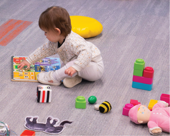 Baby playing with toys.